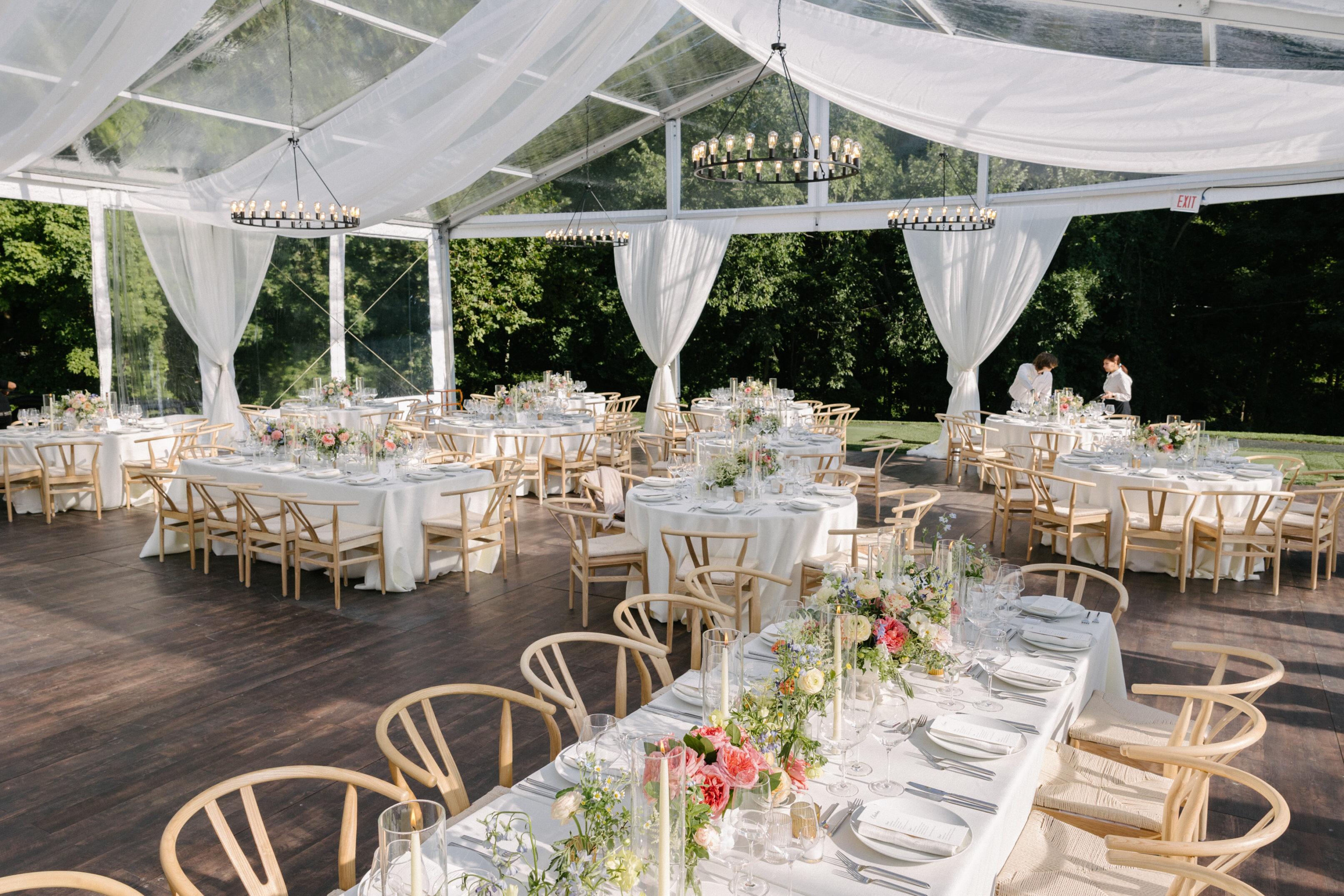 An elegant sailcloth tented wedding at a Connecticut country club. Greenwich Tent created the perfect setting for this stylish summertime celebration on the green