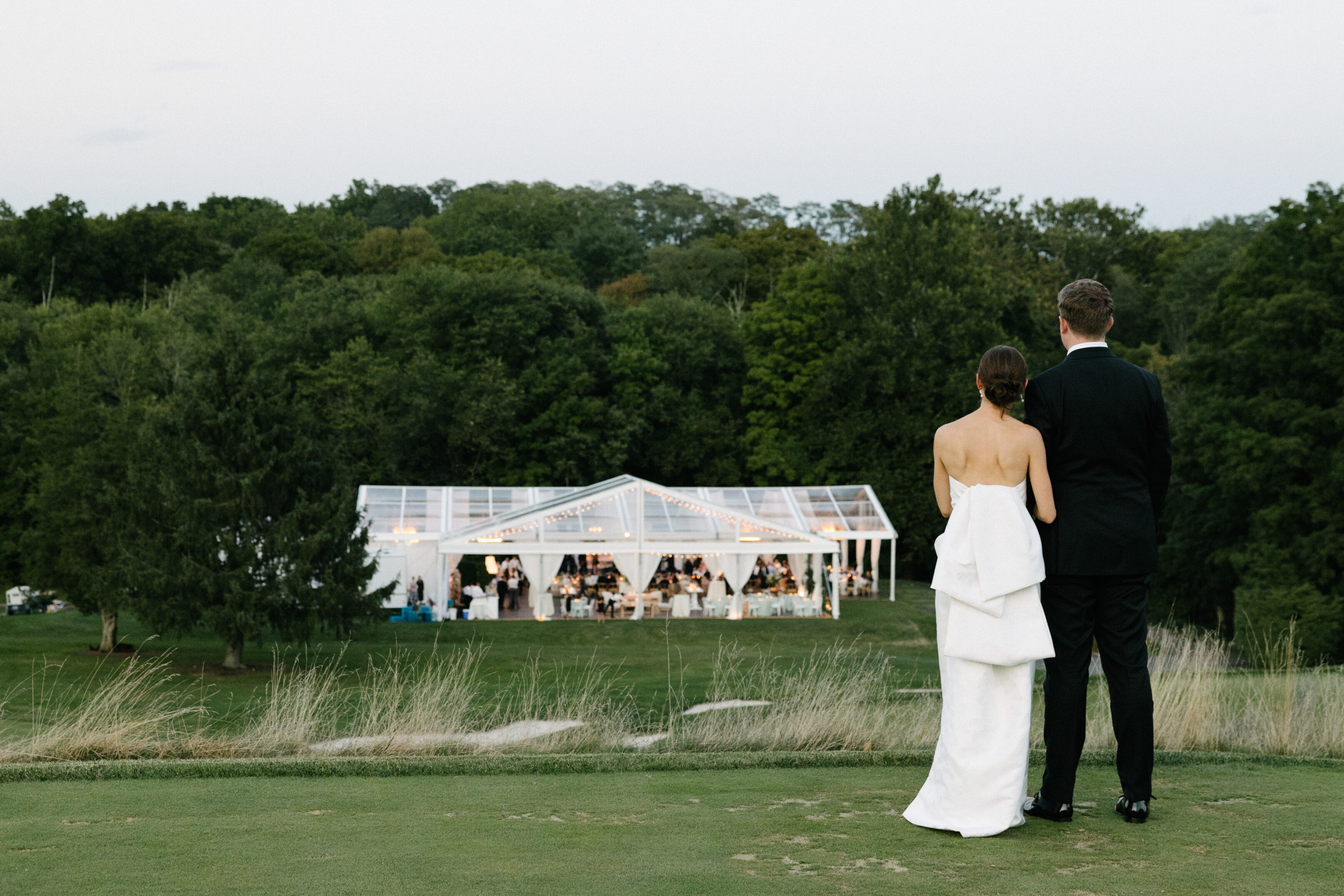 An elegant sailcloth tented wedding at a Connecticut country club. Greenwich Tent created the perfect setting for this stylish summertime celebration on the green