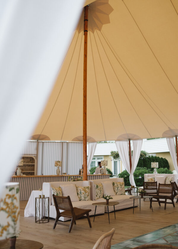 Outdoor Ocean House wedding reception under a Sperry Sailcloth Tent with full flooring. Private Events with Greenwich Tent Co. Wedding Reception in Rhode Island.