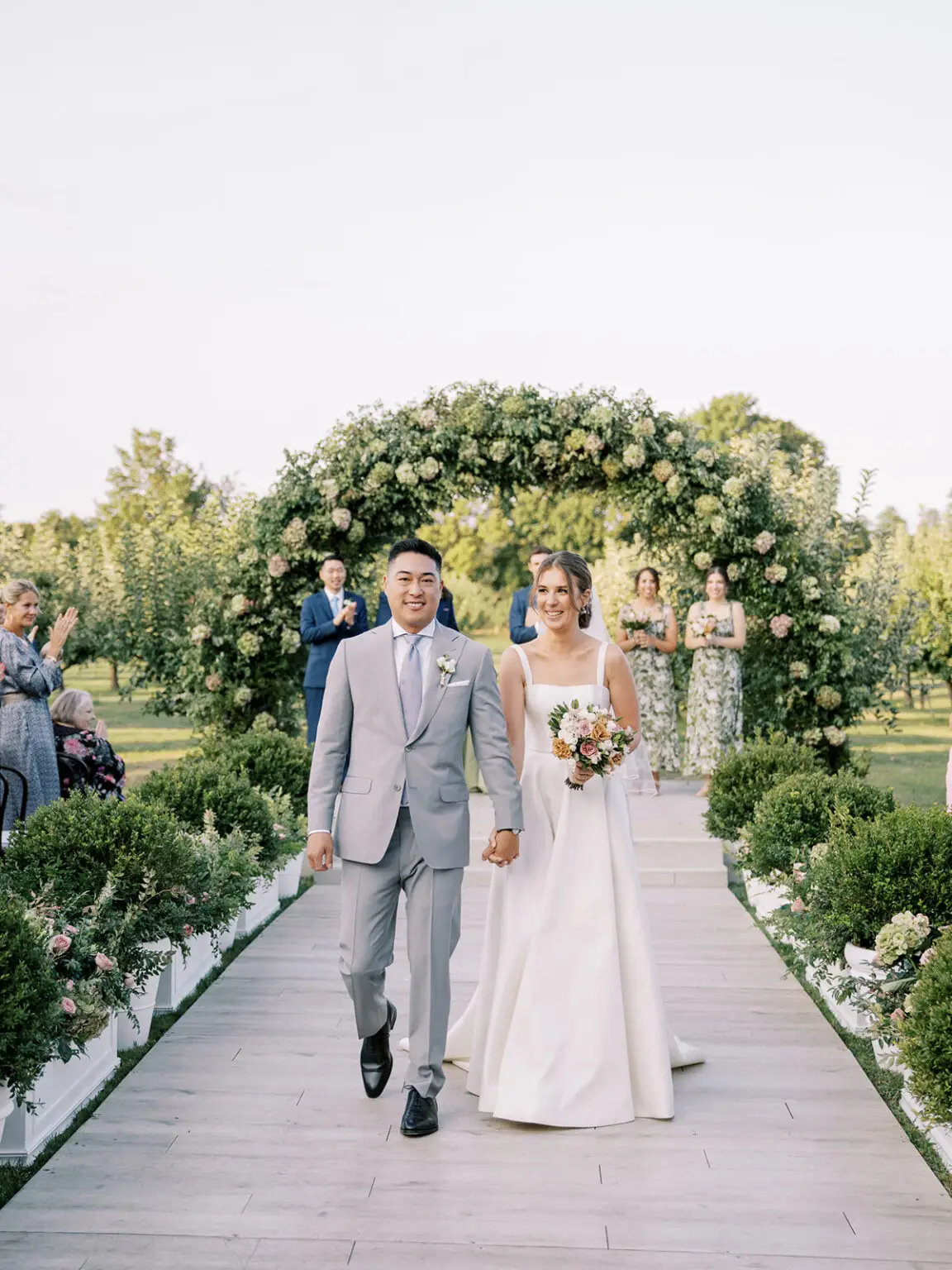 Sailcloth wedding tent in apple orchard