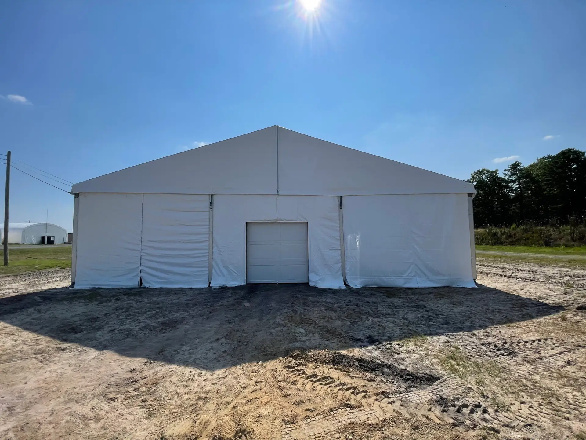 Exterior daytime white top clear span Losberger structure