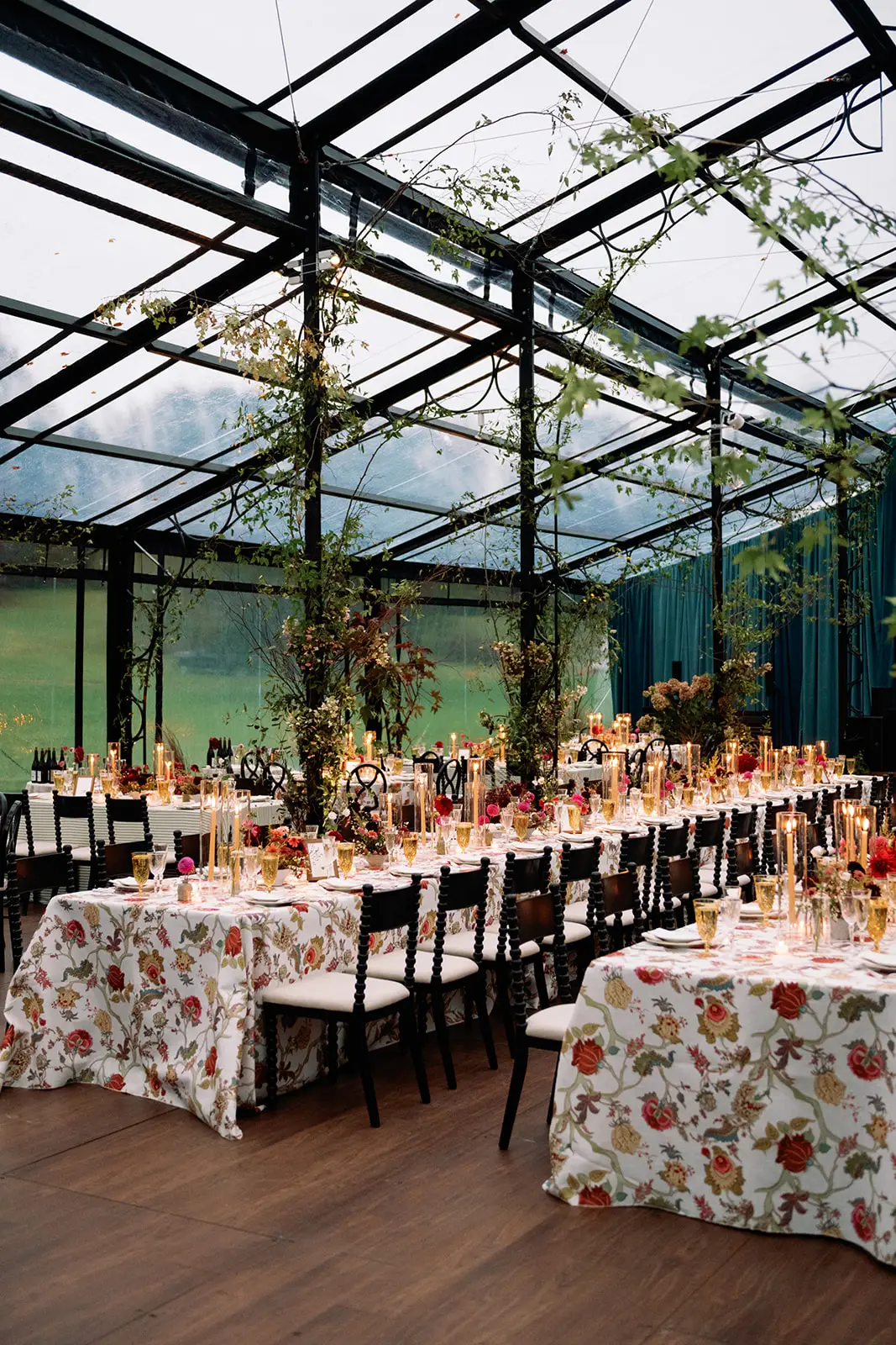 Daytime interior of the black powder coated garden structure with long dining tables