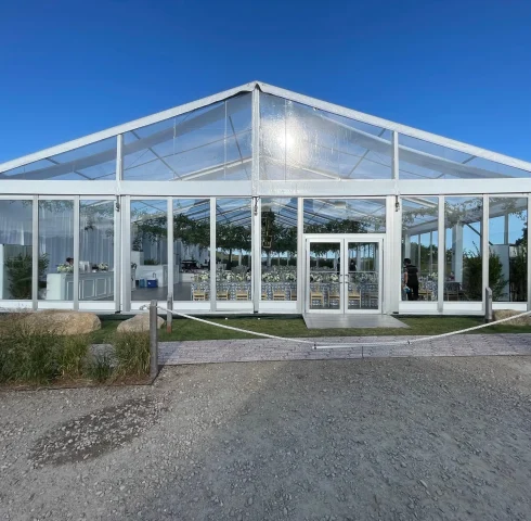 exterior day time clear span clear top Losberger structure with glass walls and doors