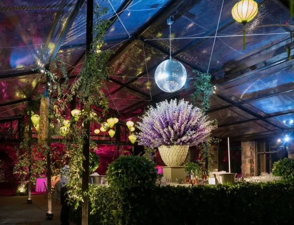 Nighttime interior of the black powder coated garden structure with decor