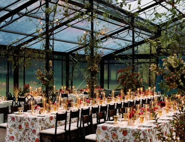 Daytime interior of the black powder coated garden structure with banquet tables