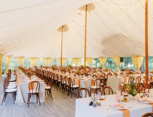 Daytime interior of Sperry sailcloth tent, full floor, floral decor