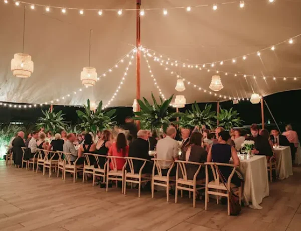 Sperry Tent with bistro lighting in Darien, CT for backyard wedding
