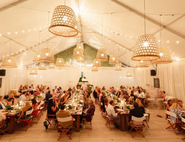 Night time interior frame tent with white tops and decor