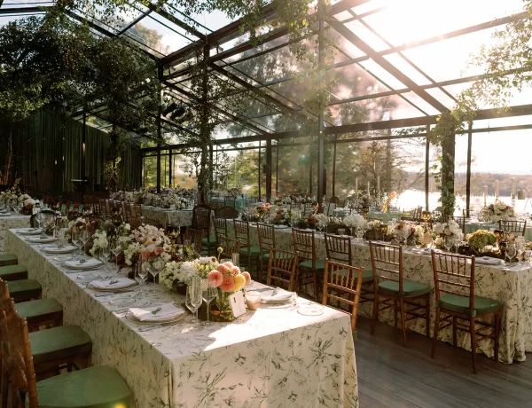 Evening interior of the black powder coated garden structure with banquet tables