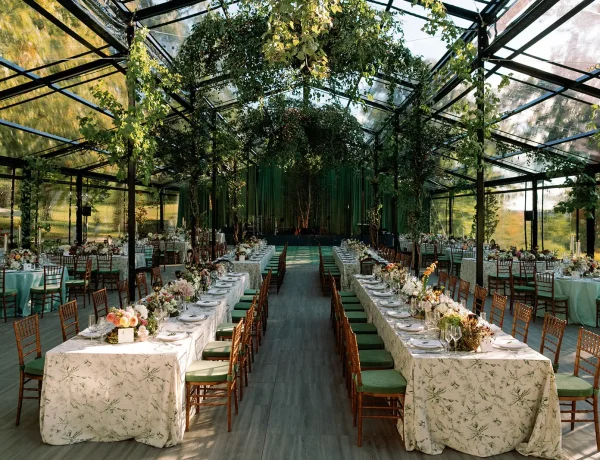 Daytime interior of the black powder coated garden structure with banquet tables