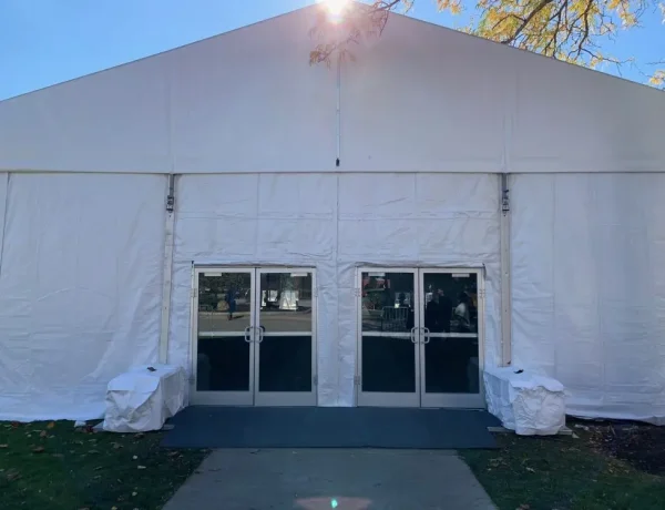 Glass doors on white frame structure tent from Greenwich Tent Company