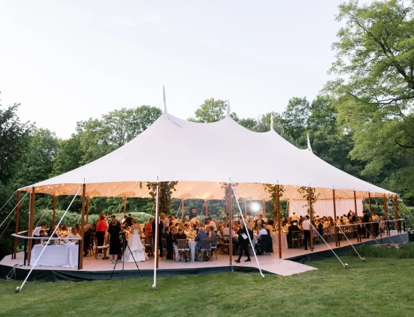 Exterior daytime Sperry sailcloth tent on a leveled floor decking