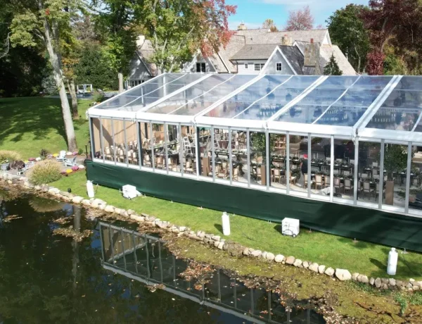 Daytime exterior clear span clear top structure on a leveled floor decking