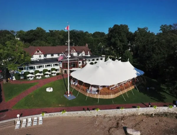 Exterior daytime Sperry sailcloth tent on a leveled floor decking